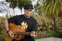 Tiki Taane with his Singing Wood guitar Tiki Taane with his Singing Wood guitar